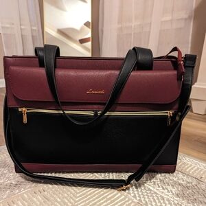 Eggplant and black women's laptop bag.